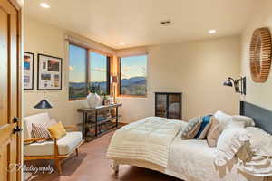 Bedroom with a mountain view and recessed lighting