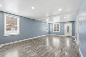 Empty room with recessed lighting, and healthy amount of natural light