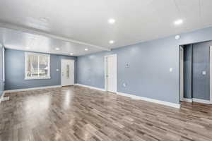 Unfurnished living room with recessed lighting.