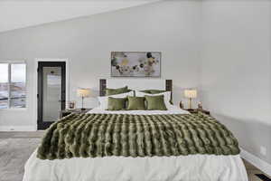 Bedroom featuring wood finished floors and baseboards