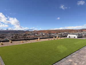 View of yard with a mountain view and a patio area