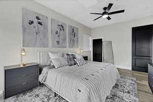 Bedroom with light wood-type flooring and ceiling fan