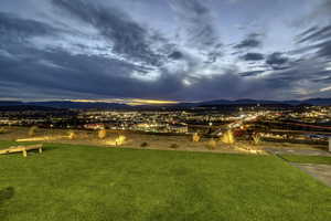 View of grassy yard with a mountain view