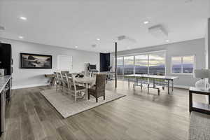 Dining room featuring light wood-type flooring and recessed lighting