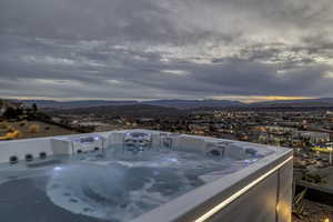Balcony with a mountain view and a hot tub