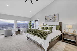 Bedroom featuring a mountain view, lofted ceiling, ceiling fan, and recessed lighting