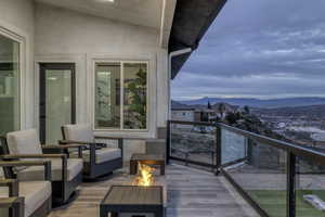 Balcony with an outdoor fire pit and a mountain view