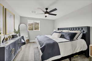 Bedroom with wood finished floors and a ceiling fan