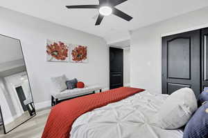 Bedroom featuring wood finished floors and ceiling fan