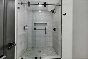 Full bathroom with a shower stall