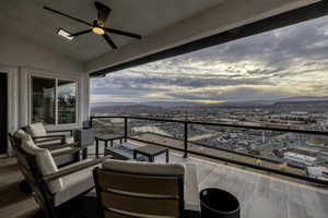 Balcony with an outdoor hangout area, ceiling fan, and a mountain view