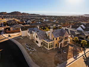 Aerial view of residential area featuring a mountainous background