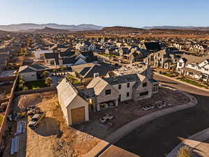 Aerial perspective of suburban area featuring a mountainous background