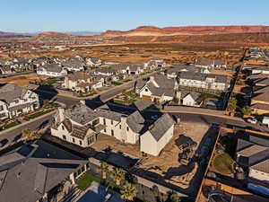 Aerial perspective of suburban area featuring a mountainous background