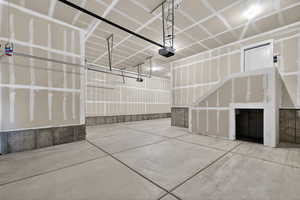 Garage featuring a garage door opener