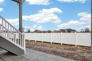 Fenced backyard with a patio