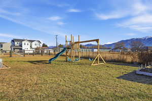 View of play area with a mountain view and a residential view