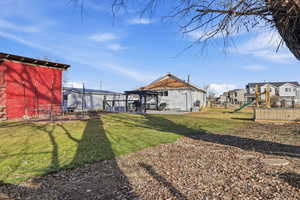 View of yard with a playground, a patio, and a residential view