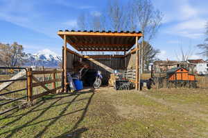 View of pole building with a mountain view