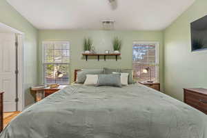 Bedroom featuring a ceiling fan and vaulted ceiling
