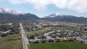 Aerial perspective of suburban area featuring a mountainous background