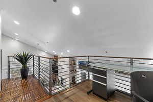 Lofted Bonus Flex Space with Custom Steel and Black Walnut Accents and Railings