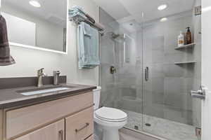 Main Level Bathroom with Modern Fixtures and Vanity
