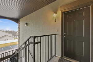 Property entrance with stucco siding