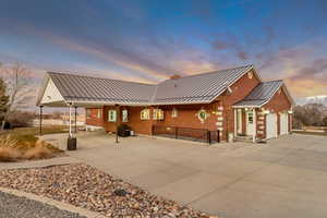 Exterior space featuring driveway, a grill, and a garage