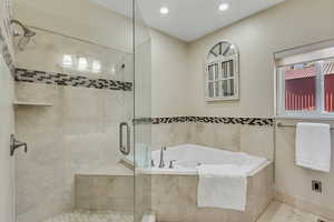 Primary bathroom featuring a shower stall, a whirlpool tub, tile patterned flooring, and recessed lighting