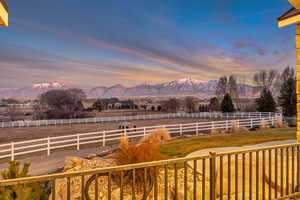Yard at dusk with a mountain view and a view of rural / pastoral area