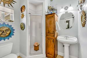 Bathroom featuring a shower stall