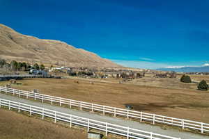 View of mountain backdrop with rural landscape
