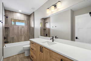 Bathroom featuring vanity and bathtub / shower combination