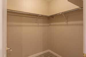 Walk in closet featuring light wood-style floors