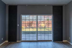 Detailed view of baseboards and wood finished floors