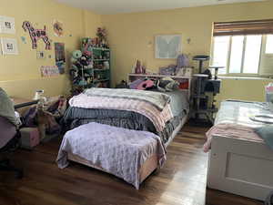 Bedroom with wood finished floors