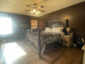 Bedroom featuring wood finished floors and a ceiling fan