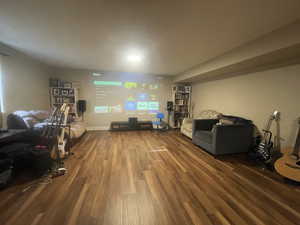Living room with wood finished floors and baseboards