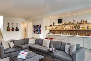 Living room featuring recessed lighting and wet bar