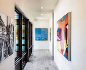 Hallway featuring light wood-style flooring and recessed lighting