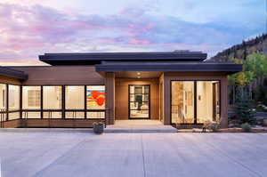 View of exterior entry at dusk