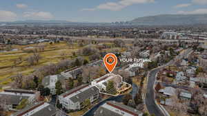 View of property location featuring a mountain backdrop and nearby suburban area