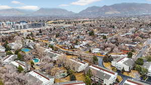Aerial overview of property's location featuring a mountain backdrop