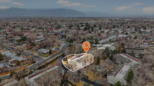 Aerial overview of property's location with nearby suburban area