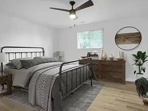 Bedroom with light wood-type flooring and a ceiling fan