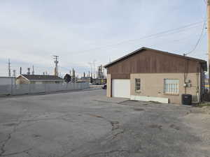 View of building exterior featuring a garage
