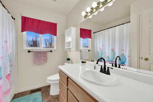 Full bathroom with vanity and a shower with curtain