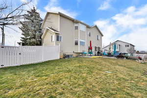 Back of house featuring a patio area and a gate