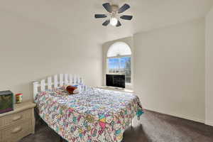 Bedroom featuring carpet and ceiling fan